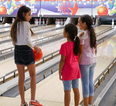 Showing younger children how to bowl