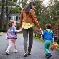 Mother walking with two children