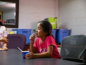 Young girl eating breakfast