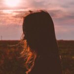 Teen Silhouetted at Sunset